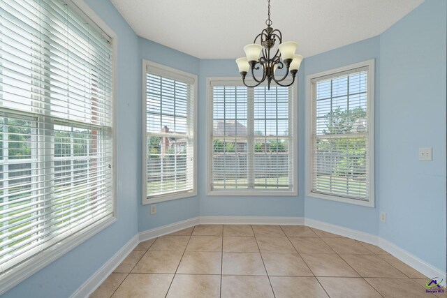 107 Rachael Ln, Warner Robins, GA 31088 - unfurnished dining area featuring healthy amount of natural light, a chandelier, and light tile patterned floors