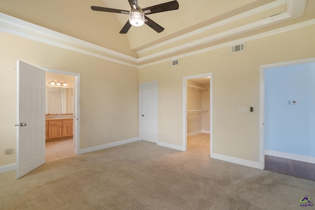 107 Rachael Ln, Warner Robins, GA 31088 - unfurnished bedroom featuring light carpet, a spacious closet, ornamental molding, a closet, and ensuite bath