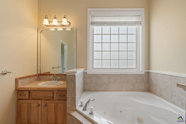 107 Rachael Ln, Warner Robins, GA 31088 - bathroom featuring vanity, healthy amount of natural light, and a whirlpool tub