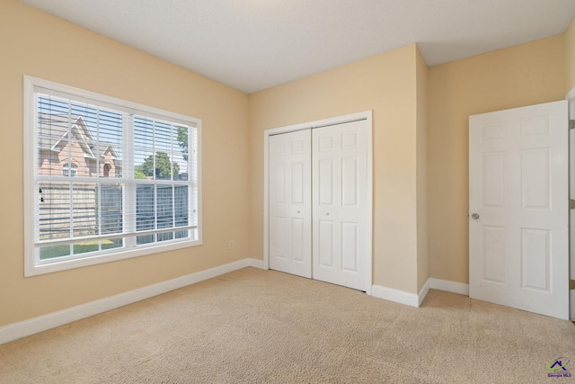 107 Rachael Ln, Warner Robins, GA 31088 - unfurnished bedroom featuring carpet floors and a closet