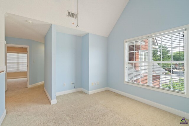 107 Rachael Ln, Warner Robins, GA 31088 - unfurnished room featuring light carpet, healthy amount of natural light, lofted ceiling, and a smoke detector