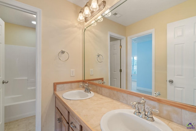 107 Rachael Ln, Warner Robins, GA 31088 - bathroom with double vanity, tile patterned flooring, and tub / shower combination