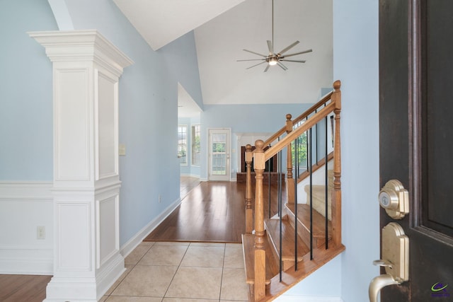 107 Rachael Ln, Warner Robins, GA 31088 - entryway featuring decorative columns, ceiling fan, stairs, light wood finished floors, and high vaulted ceiling