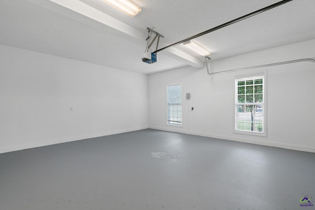 107 Rachael Ln, Warner Robins, GA 31088 - garage featuring a garage door opener and baseboards