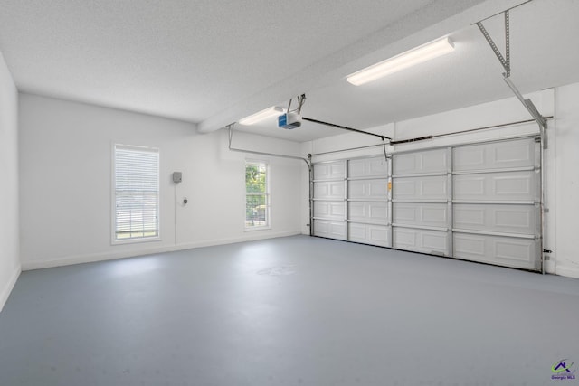107 Rachael Ln, Warner Robins, GA 31088 - garage with baseboards and a garage door opener