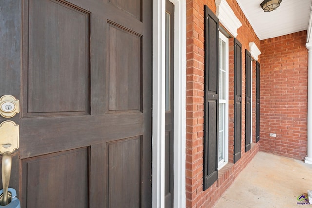 107 Rachael Ln, Warner Robins, GA 31088 - view of exterior entry featuring brick siding and a porch