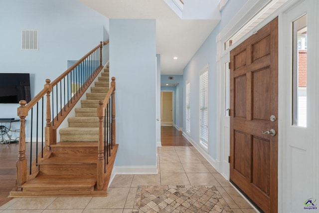 107 Rachael Ln, Warner Robins, GA 31088 - foyer with light tile patterned floors and stairs
