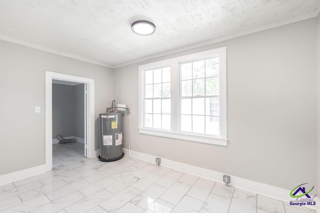 138 Comer Ter, Macon, GA 31204 - empty room featuring electric water heater, light marble finish flooring, baseboards, a textured ceiling, and ornamental molding