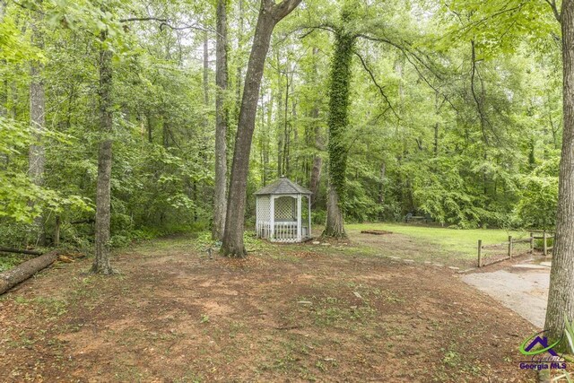 5747 Wakefield Way, Macon, GA 31210 - view of yard with a wooded view and a gazebo