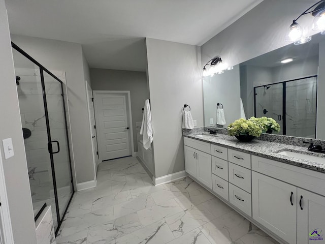 508 Nandina Ct, Warner Robins, GA 31088 - full bathroom with baseboards, double vanity, marble finish flooring, and a stall shower