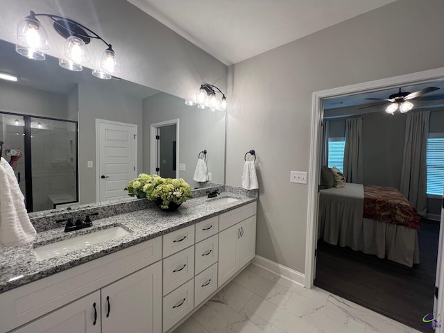 508 Nandina Ct, Warner Robins, GA 31088 - ensuite bathroom with double vanity, baseboards, a shower stall, marble finish floors, and a ceiling fan