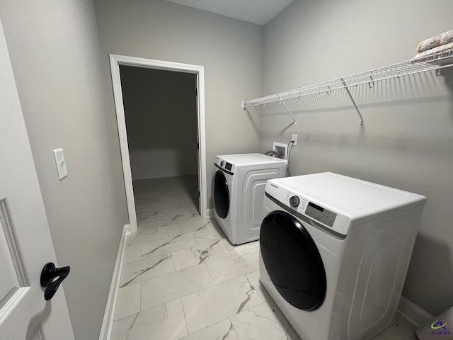 508 Nandina Ct, Warner Robins, GA 31088 - laundry area with light marble finish flooring, washing machine and dryer, and baseboards