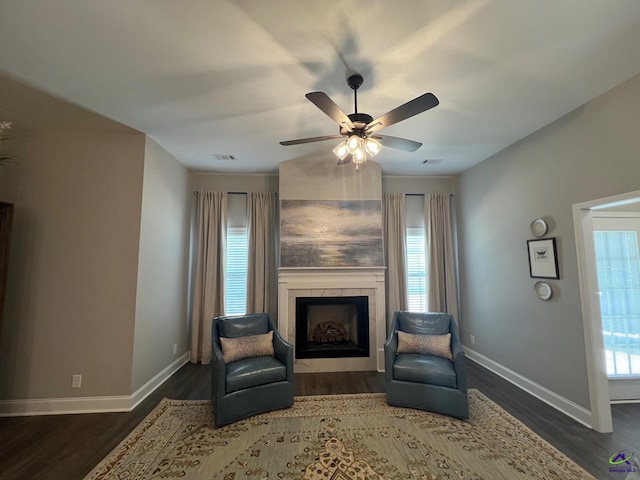508 Nandina Ct, Warner Robins, GA 31088 - sitting room with dark wood finished floors, a tile fireplace, baseboards, and ceiling fan