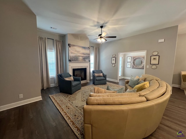 508 Nandina Ct, Warner Robins, GA 31088 - living area with dark wood-type flooring, ceiling fan, baseboards, and a tile fireplace