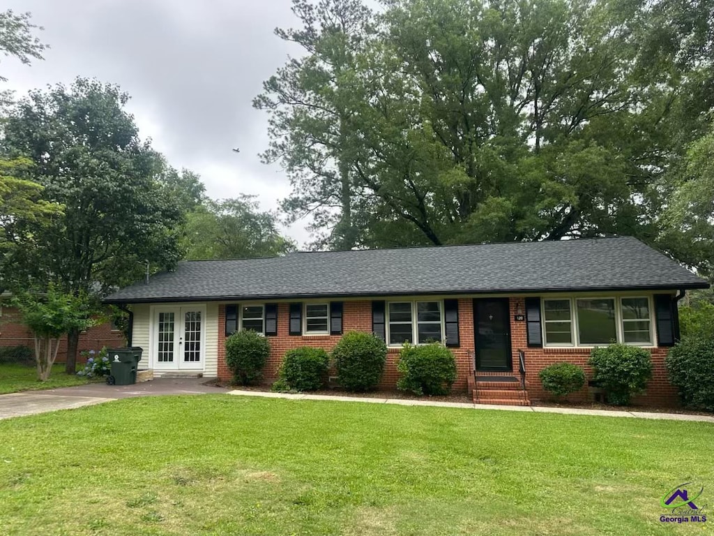 120 Springdale Dr, Warner Robins, GA 31088 - single story home featuring french doors, brick siding, a front yard, and entry steps