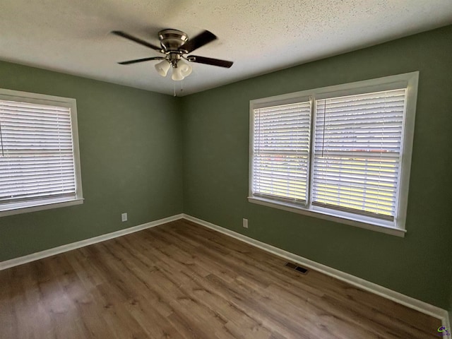 867 S Forest Lake Dr, Macon, GA 31201 - unfurnished room featuring wood finished floors, ceiling fan, baseboards, and a textured ceiling