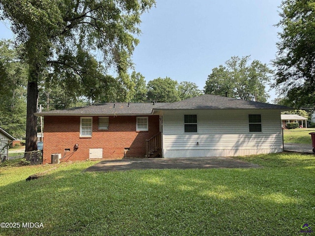 867 S Forest Lake Dr, Macon, GA 31201 - back of house with cooling unit, a yard, and brick siding