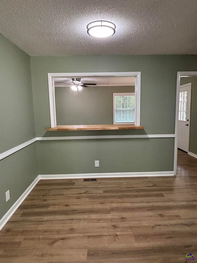 867 S Forest Lake Dr, Macon, GA 31201 - spare room featuring wood finished floors, a textured ceiling, baseboards, and ceiling fan
