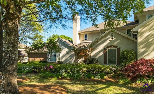 116 Maimont Cir, Macon, GA 31210 - back of house with a chimney and stucco siding