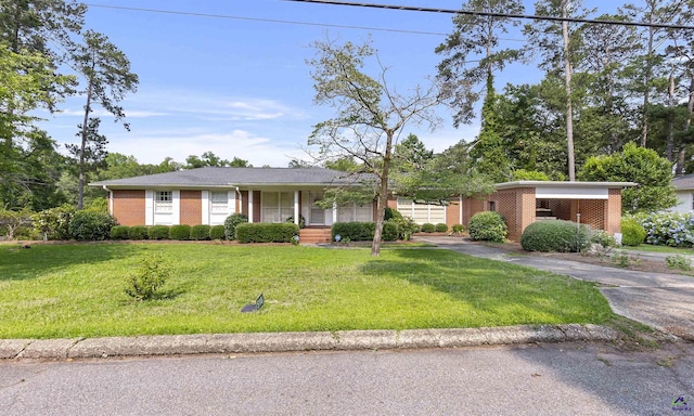 518 College St, Montezuma, GA 31063 - view of front of house with brick siding, driveway, and a front yard