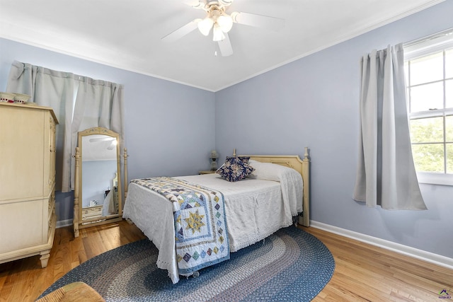 518 College St, Montezuma, GA 31063 - bedroom featuring wood finished floors, ornamental molding, baseboards, and ceiling fan