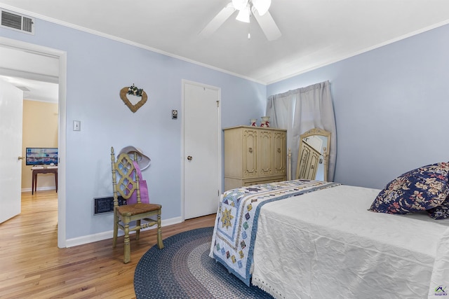 518 College St, Montezuma, GA 31063 - bedroom with light wood-style floors, ornamental molding, baseboards, and a ceiling fan
