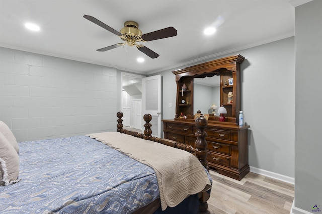 518 College St, Montezuma, GA 31063 - bedroom with light wood-style flooring, recessed lighting, baseboards, a ceiling fan, and concrete block wall
