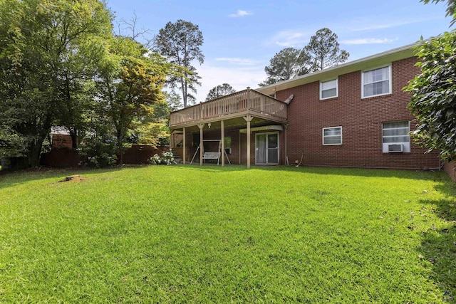 518 College St, Montezuma, GA 31063 - back of house featuring a lawn, a wooden deck, and brick siding