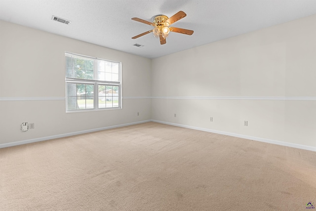 315 Woods Trl, Perry, GA 31069 - empty room with a ceiling fan, light colored carpet, and baseboards