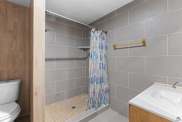 2105 Mutual Ave, Macon, GA 31204 - full bath featuring tile walls, toilet, a stall shower, vanity, and tile patterned flooring