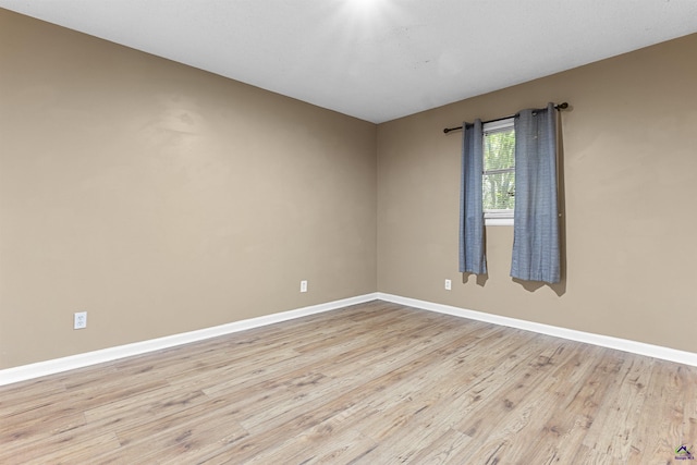 2105 Mutual Ave, Macon, GA 31204 - empty room featuring baseboards and light wood-style flooring