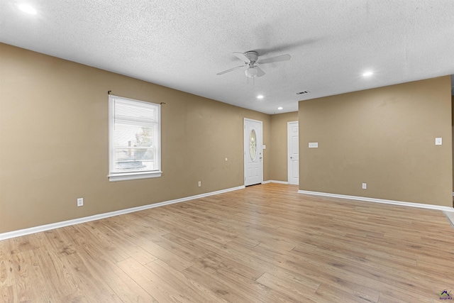 2105 Mutual Ave, Macon, GA 31204 - empty room with a ceiling fan, recessed lighting, a textured ceiling, light wood finished floors, and baseboards