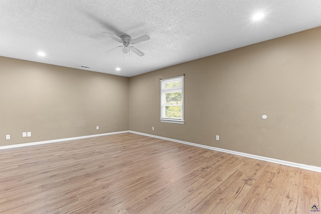 2105 Mutual Ave, Macon, GA 31204 - empty room with ceiling fan, light wood-style flooring, baseboards, a textured ceiling, and recessed lighting