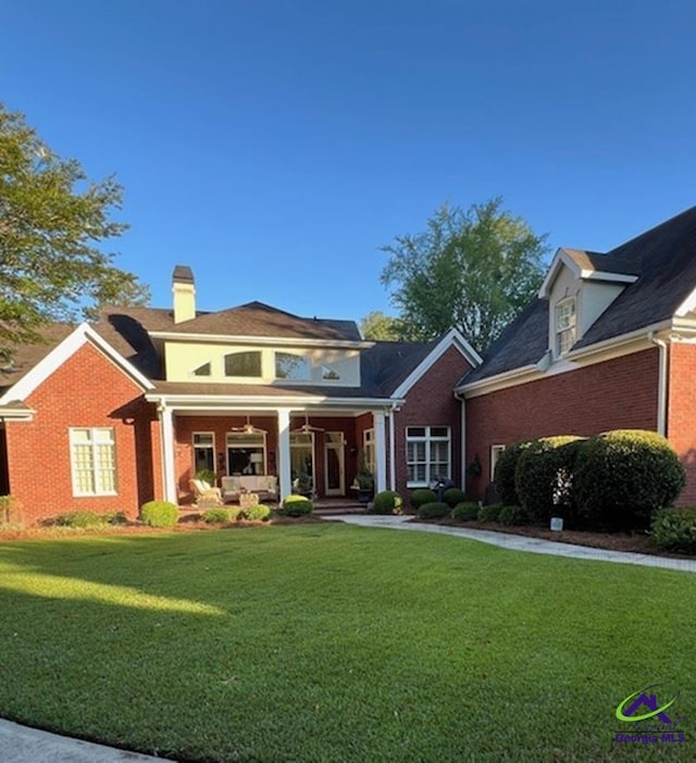 113 Troon Way, Macon, GA 31210 - view of front facade featuring a front lawn, a chimney, a porch, and brick siding