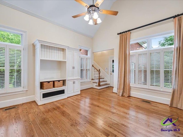 113 Troon Way, Macon, GA 31210 - unfurnished living room featuring stairway, light wood finished floors, a ceiling fan, baseboards, and high vaulted ceiling
