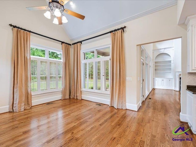 113 Troon Way, Macon, GA 31210 - empty room with a ceiling fan, lofted ceiling, light wood finished floors, baseboards, and built in shelves