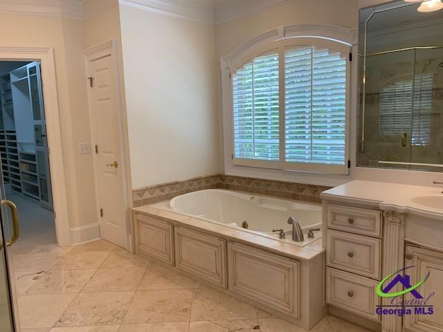 113 Troon Way, Macon, GA 31210 - full bathroom with ornamental molding, a jetted tub, vanity, a shower stall, and tile patterned floors