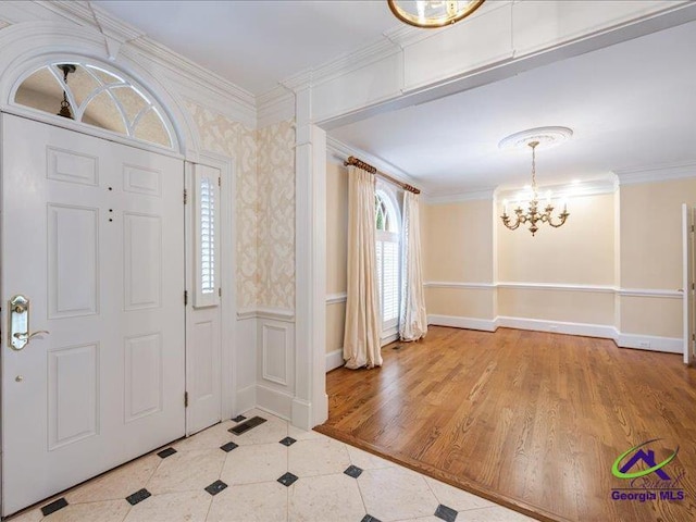 113 Troon Way, Macon, GA 31210 - foyer entrance featuring a chandelier, crown molding, a wainscoted wall, and tile patterned flooring