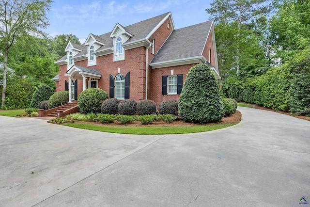 113 Troon Way, Macon, GA 31210 - view of side of property with brick siding, curved driveway, and roof with shingles