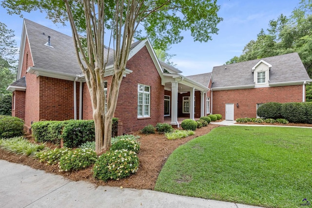 113 Troon Way, Macon, GA 31210 - view of front of house featuring a front lawn, brick siding, and a shingled roof