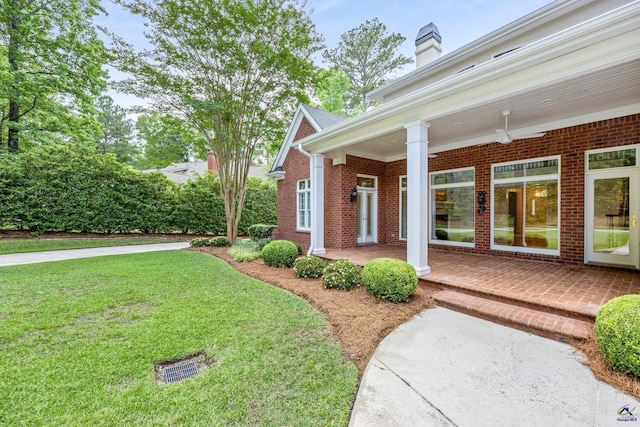 113 Troon Way, Macon, GA 31210 - property entrance featuring brick siding, a yard, and a chimney