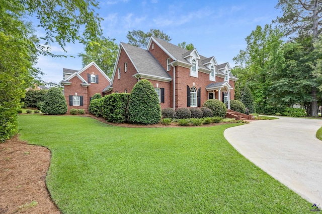 113 Troon Way, Macon, GA 31210 - view of side of home with brick siding, a lawn, and concrete driveway