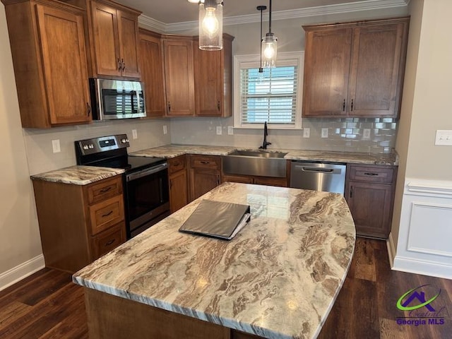 107 Huxley Ter, Bonaire, GA 31005 - kitchen with appliances with stainless steel finishes, a sink, light stone counters, dark wood-style floors, and brown cabinetry