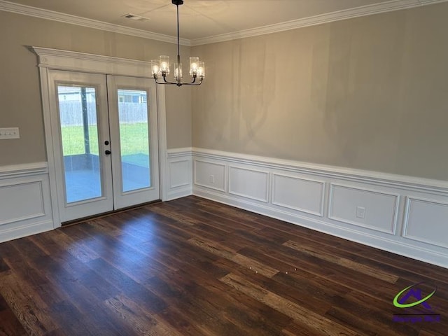 107 Huxley Ter, Bonaire, GA 31005 - unfurnished dining area with a chandelier, french doors, dark wood-style flooring, ornamental molding, and a decorative wall