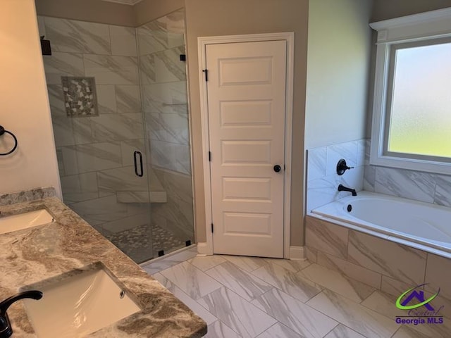107 Huxley Ter, Bonaire, GA 31005 - full bath featuring a stall shower, vanity, a bath, and marble look tiles