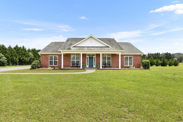 2725 Moseley Rd, Byron, GA 31008 - view of front facade with a front lawn, brick siding, and roof with shingles