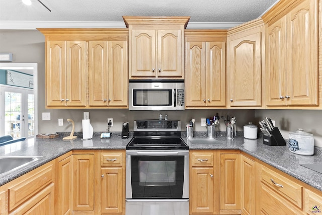 2725 Moseley Rd, Byron, GA 31008 - kitchen with appliances with stainless steel finishes, light brown cabinetry, and a sink