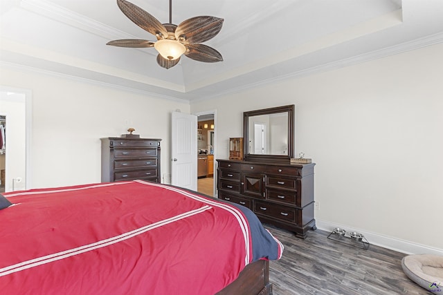 2725 Moseley Rd, Byron, GA 31008 - bedroom featuring a raised ceiling, wood finished floors, crown molding, baseboards, and a ceiling fan