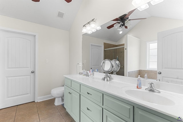 2725 Moseley Rd, Byron, GA 31008 - full bath featuring a ceiling fan, lofted ceiling, double vanity, a shower stall, and toilet