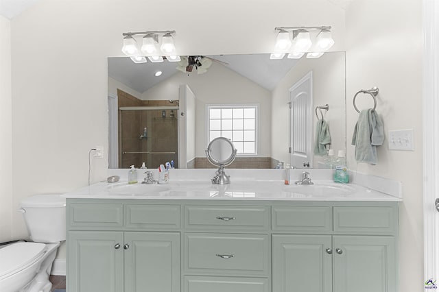 2725 Moseley Rd, Byron, GA 31008 - full bathroom featuring toilet, double vanity, ceiling fan, a shower stall, and lofted ceiling